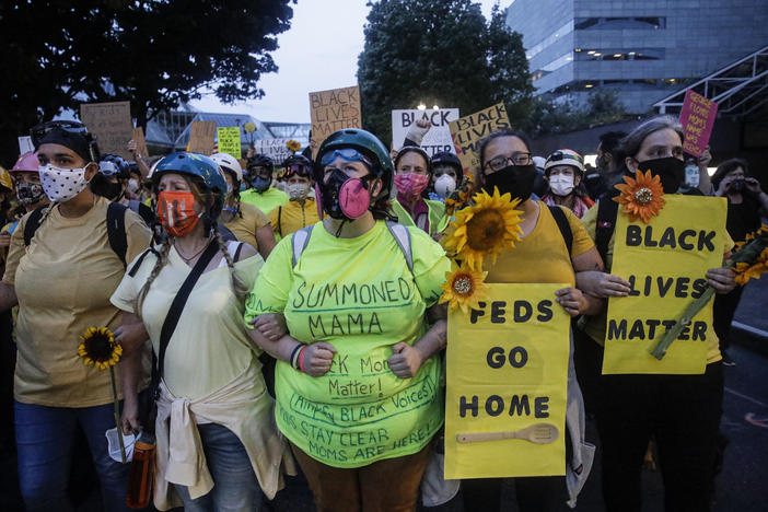 Members of the "Wall of Moms" march during a Black Lives Matter protest at the Mark O. Hatfield United States Courthouse last week in Portland, Ore.