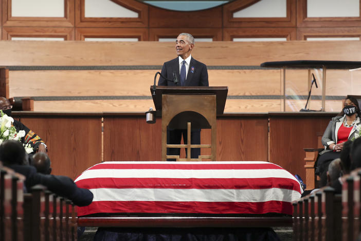 Former President Barack Obama pays tribute to the late Rep. John Lewis, D-Ga., during services Thursday at Ebenezer Baptist Church in Atlanta.