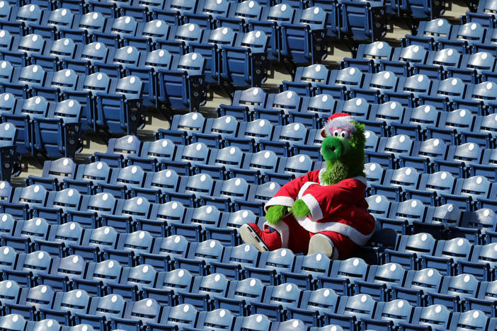 The Phillie Phanatic sits alone in the stands during a game between the Miami Marlins and the Philadelphia Phillies on Saturday. During this series, as many as 19 Marlins players and coaches had already been infected with the coronavirus.