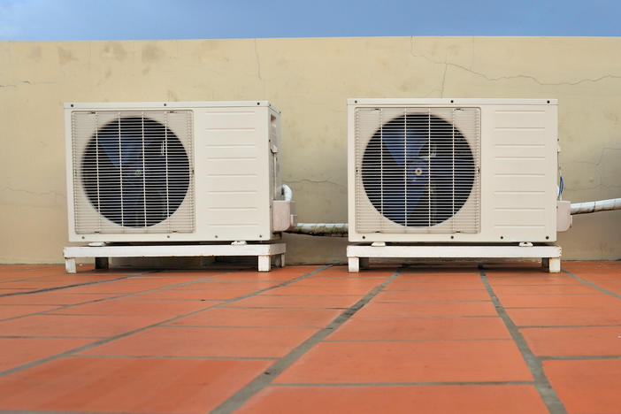 Air conditioners on a building. Scientists say there has been too little research into the role of heating, ventilation and air conditioning systems in the spread of the coronavirus.