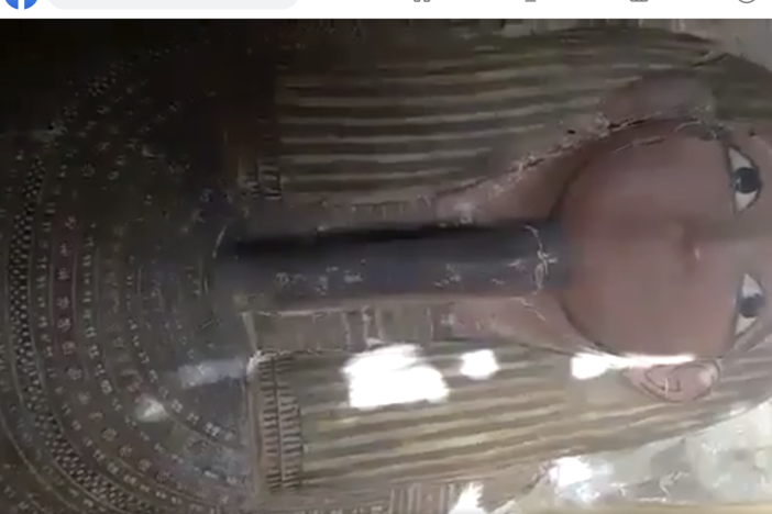 Screenshot of video on Facebook showing an Egyptian sarcophagus with mummy inside for sale. According to the ATHAR Project, the video is from an area known for extensive antiquities looting. Facebook bans trade in antiquities and human remains, but relies on user reports to flag suspect items. This post, reported by ATHAR using the Facebook system, was not deemed to violate Facebook's standards.