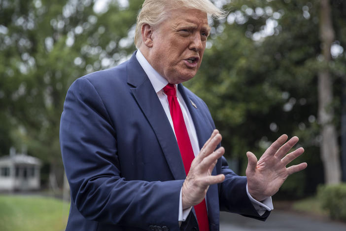 President Donald Trump chats with reporters Friday as he heads to Marine One on the South Lawn of the White House. The day before, he floated the idea of delaying the election, prompting criticism from the Federalist Society's co-founder.