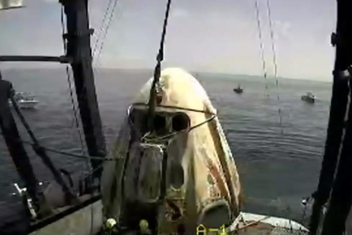 The SpaceX capsule sits aboard a recovery ship in the Gulf of Mexico.