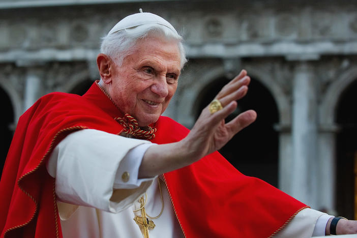 Pope Benedict XVI greets a crowd in Venice's St. Mark's Square in 2011.