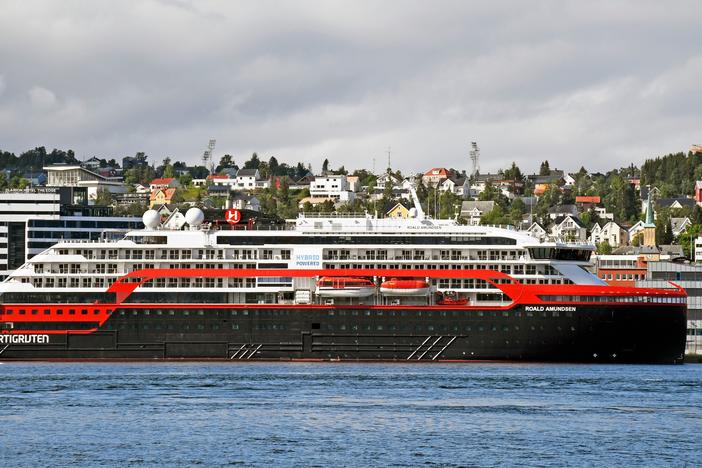 The expedition cruise ship MS Roald Amundsen is moored at a quay in Tromso, Norway, on Saturday. At least 36 crew members from the ship have tested positive for the coronavirus.