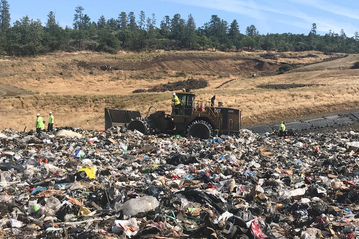 Landfill workers bury all plastic except soda bottles and milk jugs at Rogue Disposal & Recycling in southern Oregon.