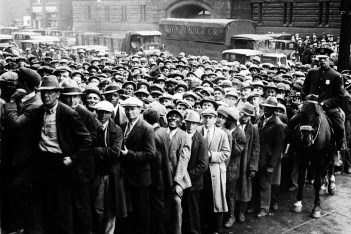 Unemployed people gather outside City Hall in Cleveland, Ohio, on Oct. 9, 1930 during the Great Depression.