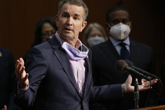 Virginia Gov. Ralph Northam speaks during a news conference in Richmond, Va. on June 4. Virginia has rolled out a smartphone app to automatically notify people if they might have been exposed to the coronavirus.