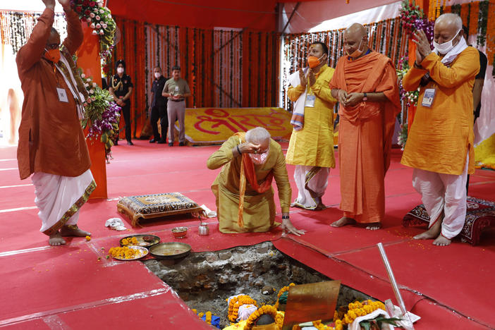 Indian Prime Minister Narendra Modi, center, performs the groundbreaking ceremony of a temple dedicated to the Hindu god Ram, watched by Rashtriya Swayamsevak Sangh (RSS) chief Mohan Bhagwat, right, and others in Ayodhya, India, on Wednesday.