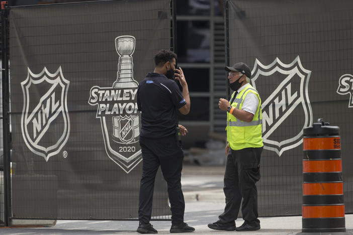 Personnel enter and exit the NHL bubble in Toronto, one of two host cities, along with Edmonton, where the league has resumed its season.