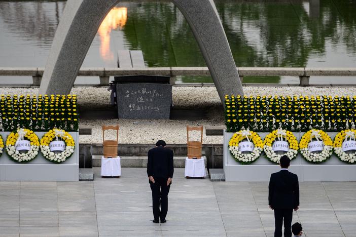 Japanese Prime Minister Shinzo Abe bows Thursday in front of a memorial to people who were killed in the 1945 atomic bombing of Hiroshima.