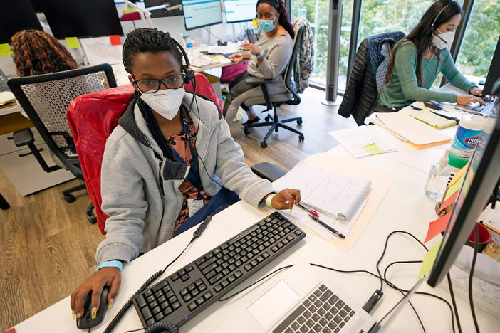 Contact tracers (from left) Christella Uwera, Dishell Freeman and Alejandra Camarillo work at Harris County Public Health Contact Tracing facility in Houston in June.