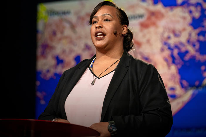 Colette Pichon Battle speaks from the TED stage.