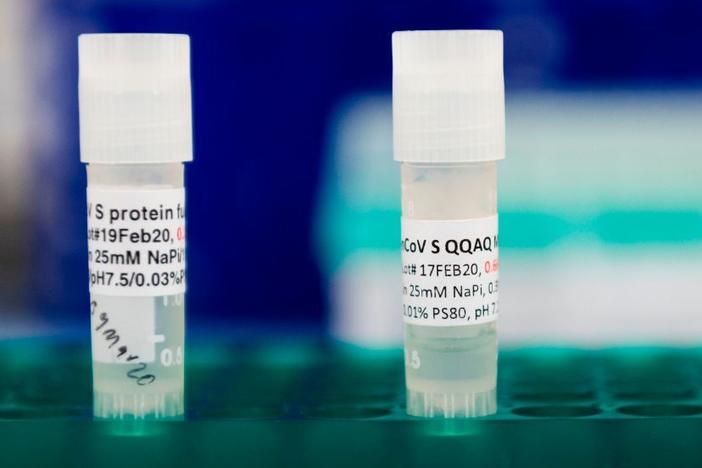Potential COVID-19 vaccines are kept in a tray at Novavax labs in Maryland on March 20. The Novavax vaccine requires an immune-boosting ingredient called an adjuvant to be effective.
