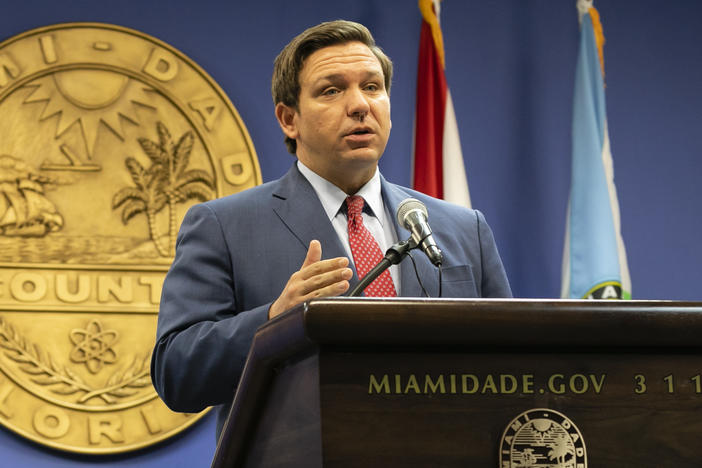 Florida Gov. Ron DeSantis, here in June, said this week that the state's troubled unemployment portal was designed to discourage people applying for benefits. The portal launched in 2013 under then-Gov. Rick Scott, now a U.S. senator.