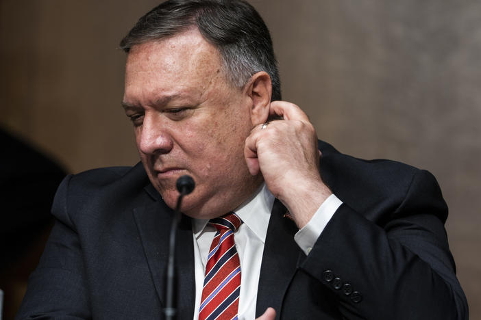 Secretary of State Mike Pompeo testifies before a Senate Foreign Relations Committee hearing in July. The State Department has lifted its global health advisory warning against international travel.