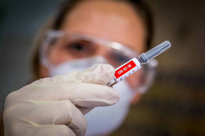 A nurse holds a COVID-19 vaccine candidate produced by Chinese company Sinovac Biotech at the São Lucas Hospital in Porto Alegre, Brazil, on Aug. 8.