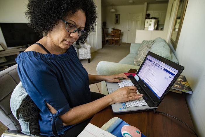 Care resource coordinator Luisa Schaeffer scrolls through her COVID-19 isolation case list for the day: One woman is out of milk, while another needs help finding a doctor and making an appointment. A man also asks about getting help to pay rent.