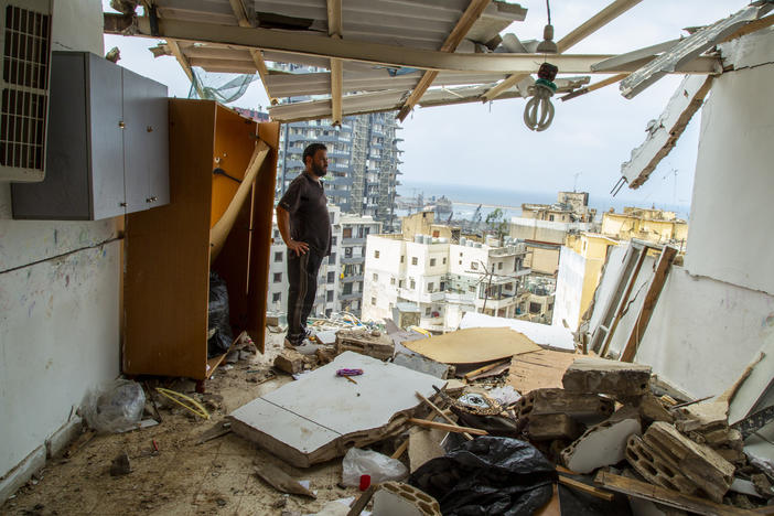 Habeb al-Hamad Azab, a Syrian refugee, stands in front of his destroyed home in Beirut's Mar Mikhael neighborhood.