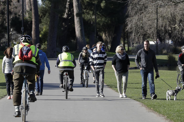 Residents exercise Sunday at Hagley Park in Christchurch, New Zealand. The country's border remains closed to foreign nationals, and New Zealanders returning home are forced to follow a strict 14-day quarantine.