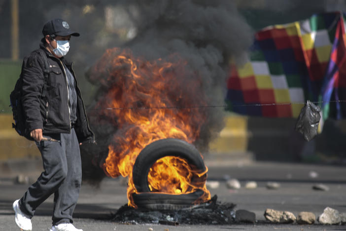 Demonstrators block roads to protest the postponement of presidential elections in El Alto, Bolivia.