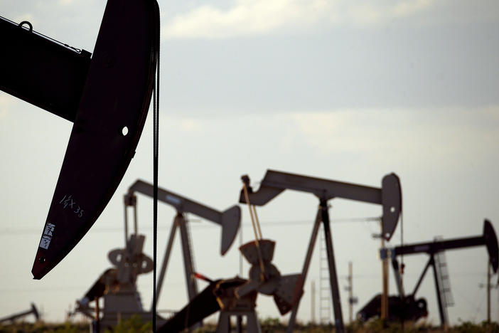 Pump jacks work in a field near Lovington, N.M., in 2015. The Trump administration is lifting an Obama-era rule aimed at limiting emissions of methane, a potent climate-warming gas.