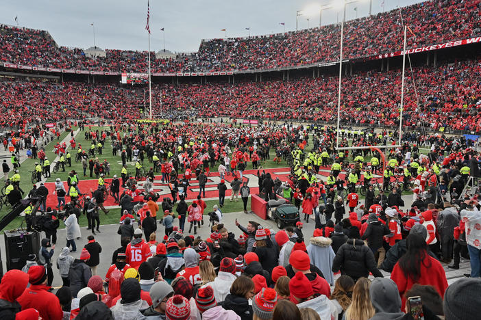 Fans rush the field after the Ohio State Buckeyes defeat the Penn State Nittany Lions 28-17 in November in Columbus, Ohio. The Big Ten and PAC-12 have put fall sports on hold due to the pandemic.