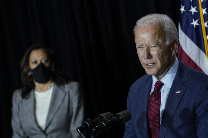 Presumptive Democratic presidential nominee Joe Biden speaks Thursday after a coronavirus briefing with health experts and his newly named running mate, Sen. Kamala Harris, at the Hotel DuPont in Wilmington, Del. Biden took off his mask to speak.
