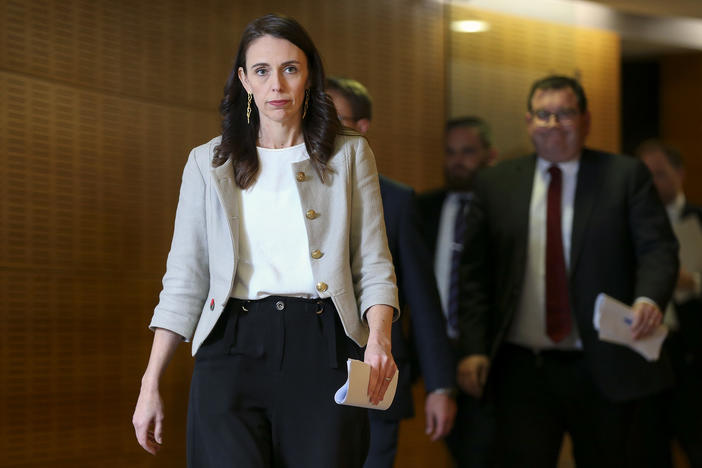 New Zealand Prime Minister Jacinda Ardern arrives for a press conference Friday in Wellington. A new coronavirus outbreak has grown to 30 cases, and Ardern predicts of the cluster, "It will grow before it slows."