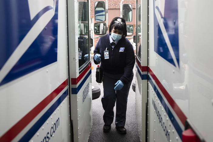 United States Postal Service carrier Henrietta Dixon gets into her truck to deliver mail in Philadelphia on May 6.
