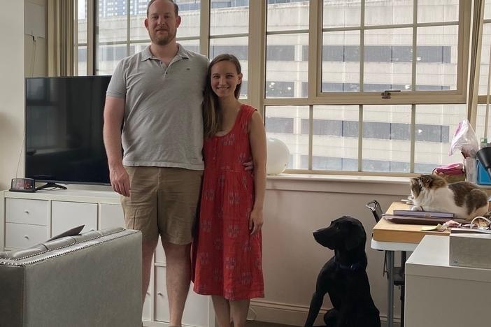 Lisa Vrooman with her boyfriend John Rock, dog Umar and cat Mochi. They love the high ceilings in their 650-square-foot apartment, but keeping it cool is costly.