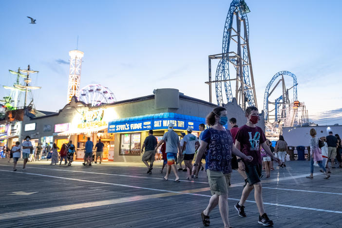 Masks are a common fixture on the boardwalk in Ocean City, N.J., as the state continues with Stage 2 of its reopening.