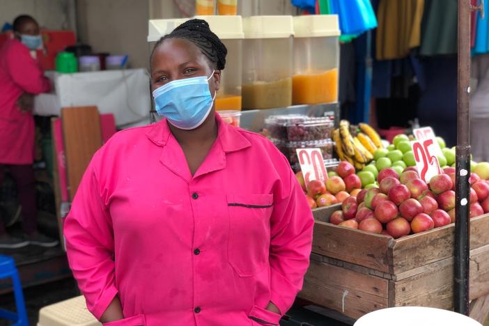 Monica Muthuma has been selling fruits, vegetables and dawa for five years at this stand. Since the pandemic began peaking in Kenya, she says, her ginger-infused drink has taken center stage at her store.