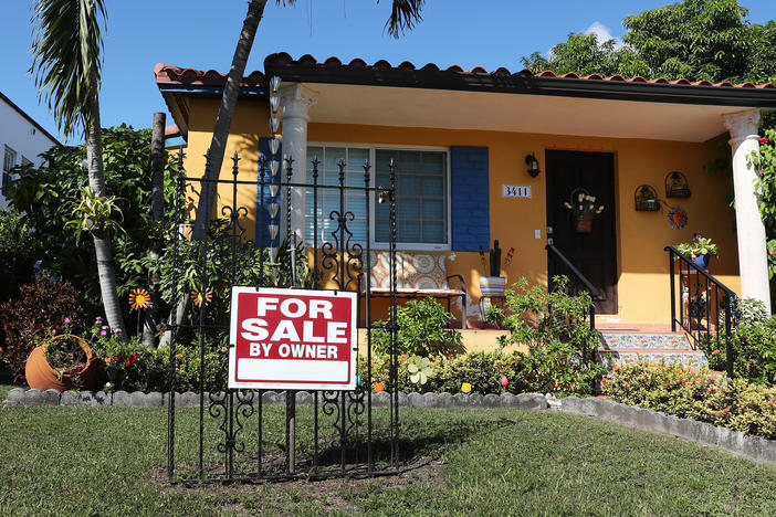 A sale sign is seen in front of a home in Miami. FHA loans are used by many minority, lower-income, and first-time homebuyers because the low down payments make homeownership more affordable. But this demographic is more likely to be hurt financially during the pandemic, and many FHA borrowers are skipping mortgage payments.