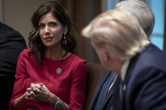 South Dakota Gov. Kristi Noem meets with President Trump and Vice President Pence at the White House in December. This month, she was one of the first governors to reject the president's offer of additional unemployment assistance.