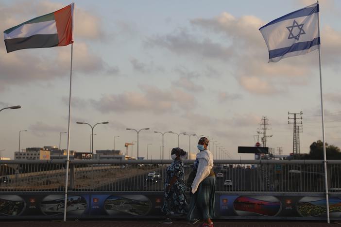 The flags of the United Arab Emirates and Israel are raised on the Peace Bridge in Netanya, Israel. The UAE flag was displayed to celebrate last week's announcement that the two countries have agreed to establish diplomatic relations.