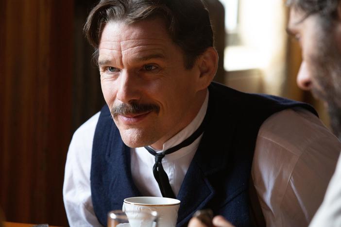 Ethan Hawke plays Serbian American inventor Nikola Tesla in the playful new biopic, <em>Tesla</em>.