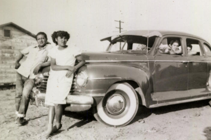 Ricardo "Papu" Ovilla, left, and the family's first car. Ovilla is pictured with his children Martha (next to him) and Aurelia and Rodolfo Sandoval (left to right, inside the car) in a photo taken in 1949 at a labor camp in Escondido, Calif.