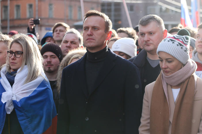 Alexei Navalny is seen during a rally in Moscow last year along with his wife, Yulia (right). She and his personal doctor were reportedly prevented from seeing him in the hospital.