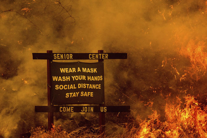 Flames from the LNU Lightning Complex fires burn in unincorporated Napa County, Calif., on Tuesday.