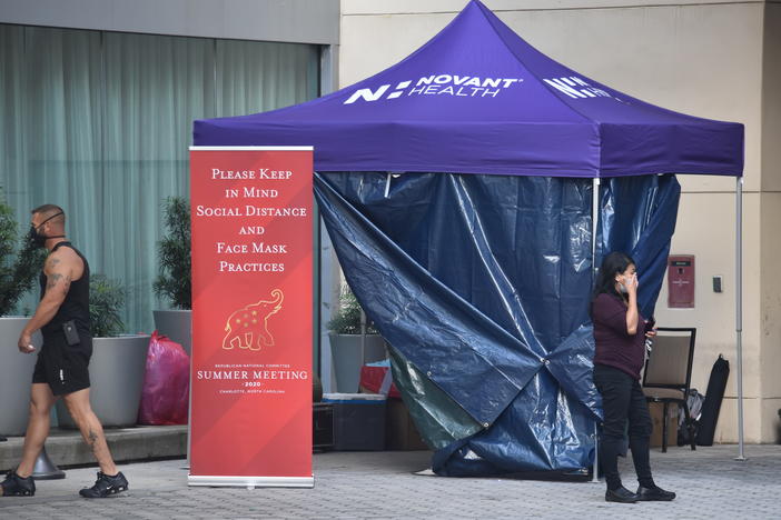 Convention attendees must get a coronavirus test upon arrival and carry badges that record their movements.
