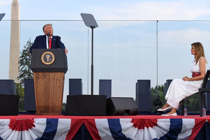 President Trump speaks on the South Lawn of the White House, accompanied by First Lady Melania Trump, on July 4. He'll deliver his main convention speech from the same location on Thursday.