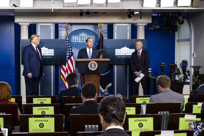 President Donald Trump, left, FDA Commissioner Stephen Hahn, right, and Health and Human Services Secretary Alex Azar, center, announced at a news conference on Sunday that the FDA issued emergency use authorization for convalescent plasma as a COVID-19 treatment.