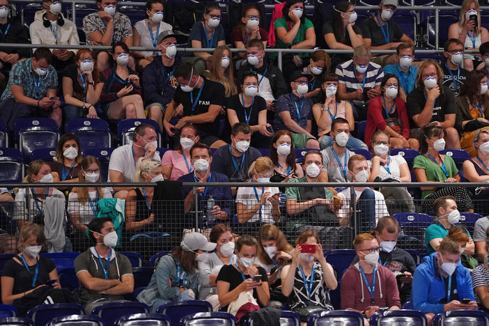Participants wearing face masks in Leipzig, Germany, take part Saturday in a study to test how the coronavirus might spread in concert settings.