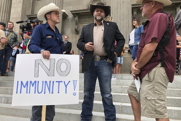 Ammon Bundy (center), who led the Malheur National Wildlife Refuge occupation, joins protesters outside the Idaho Statehouse steps in Boise on Monday.