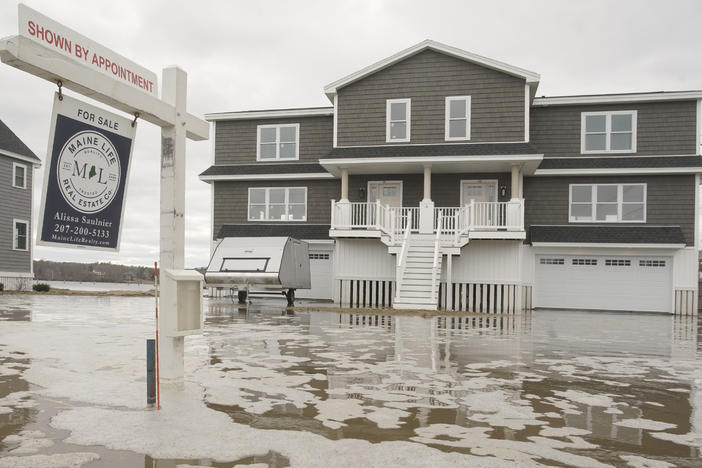 Floodwaters surround a newly constructed house for sale in Maine in 2018. Realtor.com added flood risk information to the more than 100 million listings on its site.