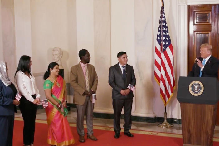 President Trump hosts a naturalization ceremony for new citizens in a prerecorded video that was broadcast during the GOP's virtual convention on Tuesday. Trump and other members of his administration are facing criticism for using official resources for a political event.