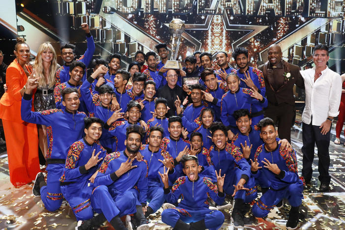 V Unbeatable, the dance troup from Mumbia that won the top prize on <em>America's Got Talent: The Champions</em> this year, are pictured with (left to right) Alesha Dixon, Heidi Klum, Howie Mandel, Terry Crews and Simon Cowell.