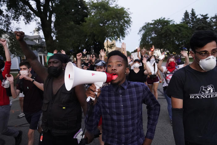 Protesters march Wednesday against the police shooting of Jacob Blake in Kenosha, Wis., over the weekend.