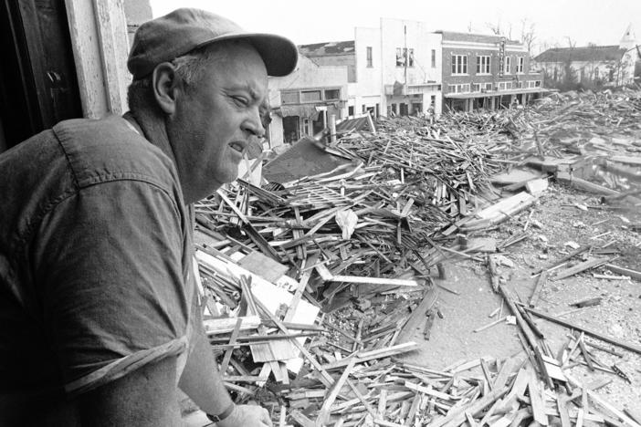 Parnell McKay, the civil defense director of Pass Christian, Miss., looks over the town's main business district on Aug. 23, 1969 after Hurricane Camille passed through.